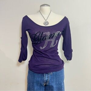 Purple off the shoulder top with rhinestone glam graphic